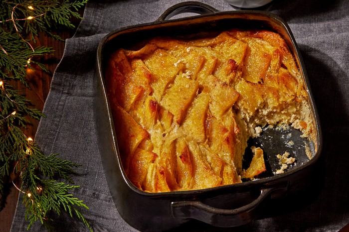 A black baking dish filled with slices of baked bread with marmalade