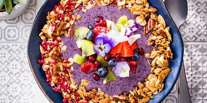 Blueberry Smoothie and Granola Bowls in a White Bowl