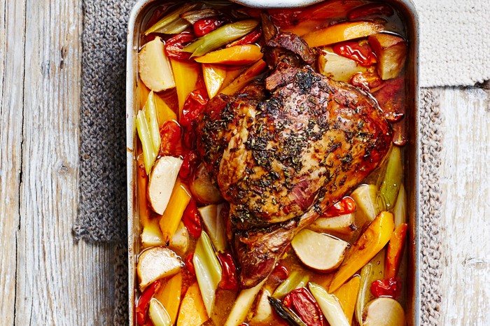 Lamb and slices of autumn veg served in a baking dish