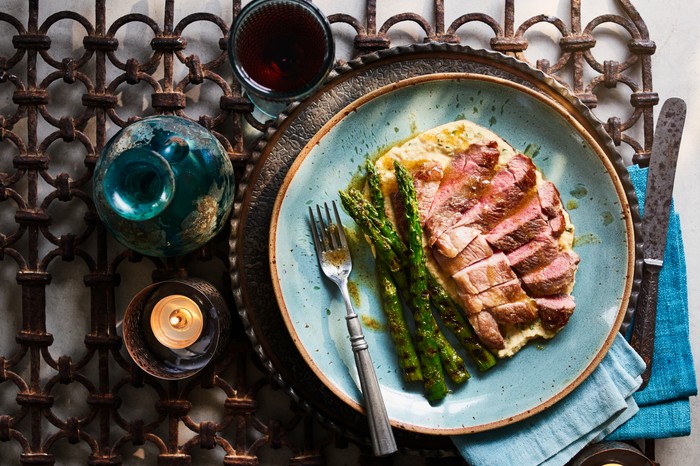 Lamb steaks with yeast butter and warm hummus