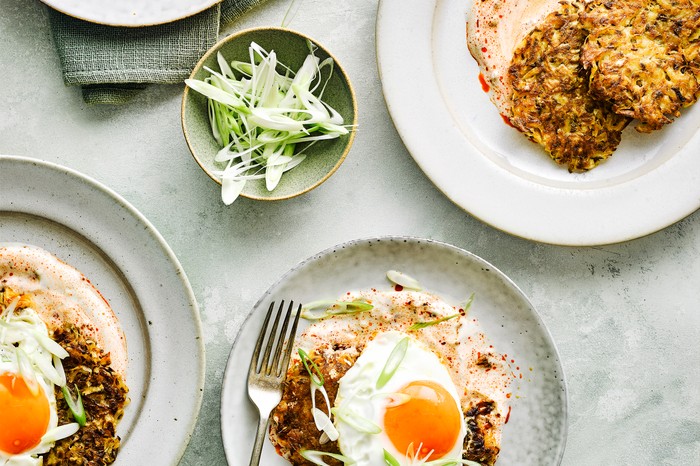 Plates of rostis with fried eggs on top