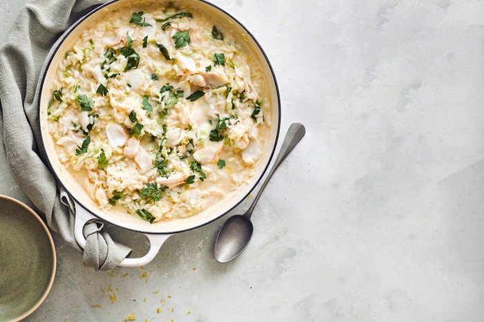 A risotto in a circular enamel dish