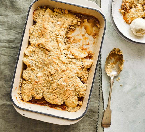 A whole pear crumble in a rectangular dish