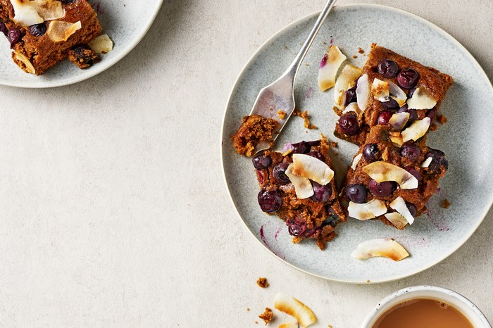 Two Plates Topped with Healthy Blondies with Blueberries and Coconut