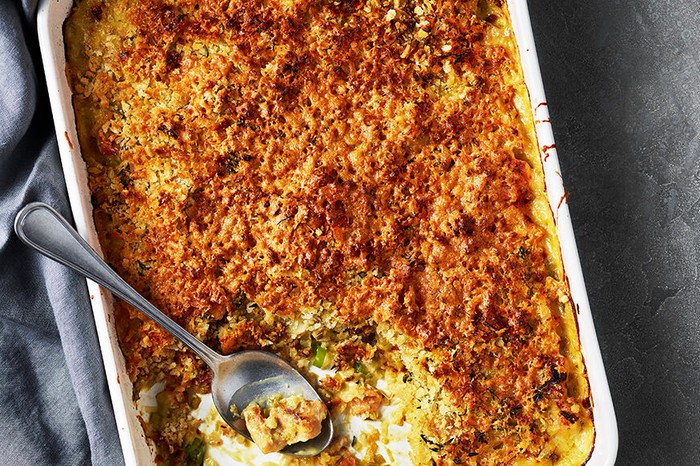 A savoury baked dish with a serving spoon in it