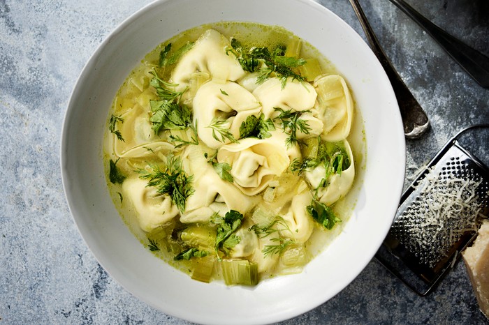 Tortellini broth in a bowl