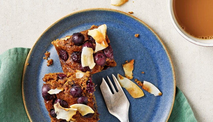 Vegan blueberry coconut blondies on a blue plate