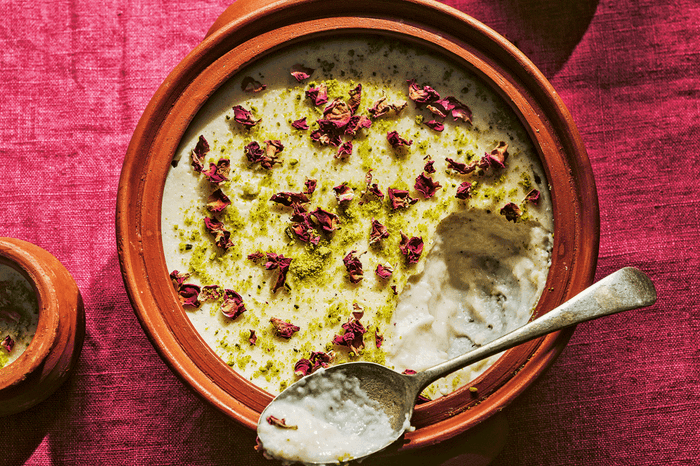 Ground rice pudding with cardamom (firni) in a bowl with a spoon