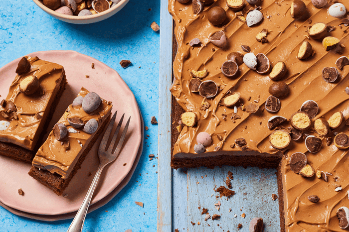 Malted milk chocolate traybake with a slice taken out