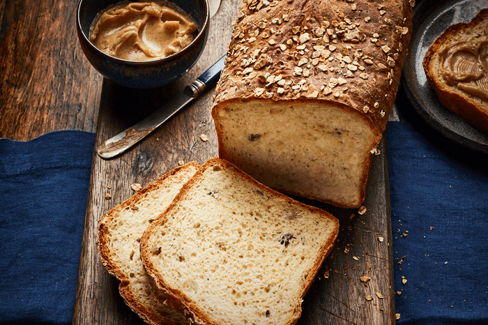 Porridge loaf with some slices cut out of it